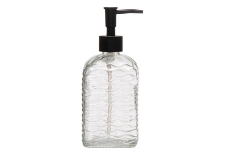 Clear glass soap dispenser with black pump on a white background