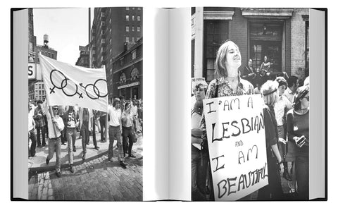 Open book showing black and white photos of a protest with people holding signs.