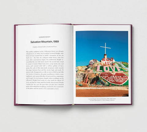 Open book showing a photograph of Salvation Mountain with text on a white background