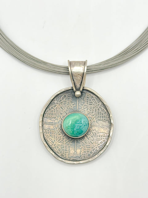 Pendant with light blue stone