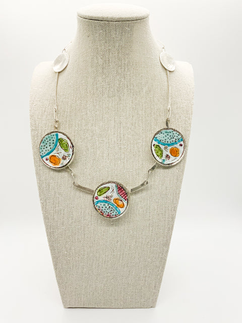 3 Disk Necklace, with various colors displayed on a mannequin bust.