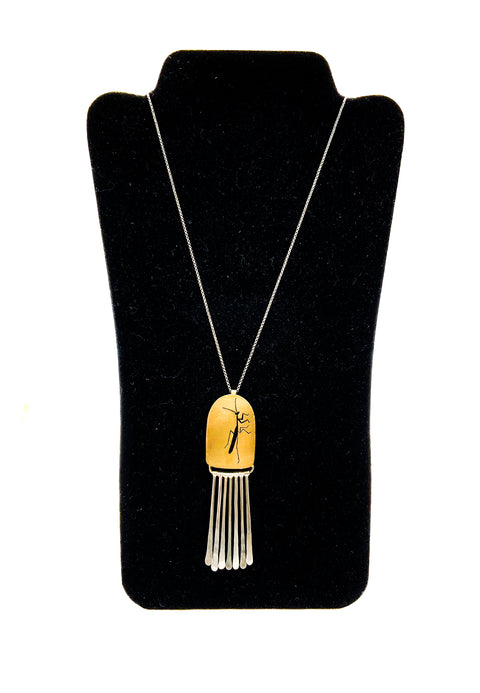 Prayingmantis shadowbox brass necklace displayed on a mannequin.