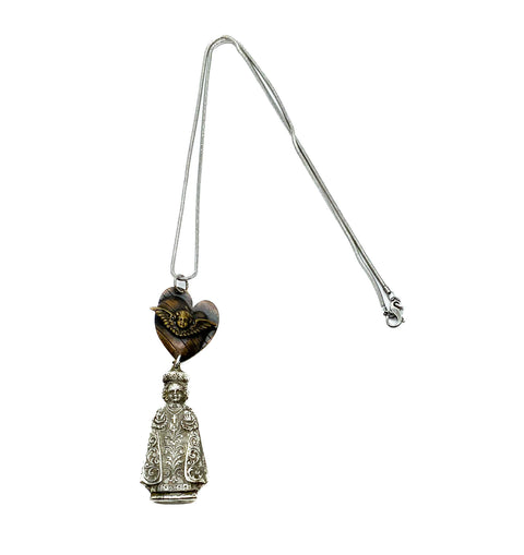 Angel pendant in a heart with a priest