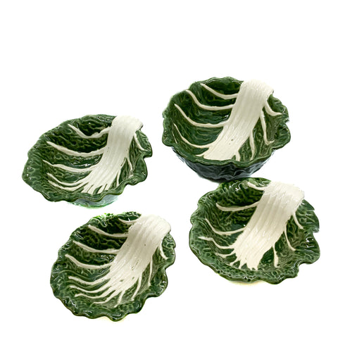 A set of four stoneware bowls in green color, with a leaf pattern resembling a cabbage shape.