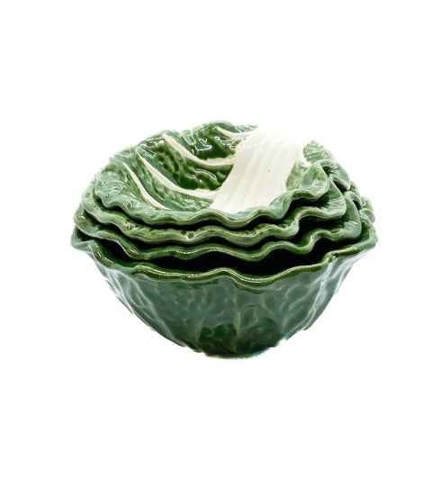 A set of four stoneware bowls in green color, with a leaf pattern resembling a cabbage shape, stacked inside each other.