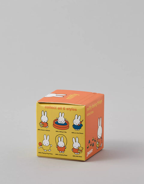 Small orange and yellow box with Miffy characters on a gray background