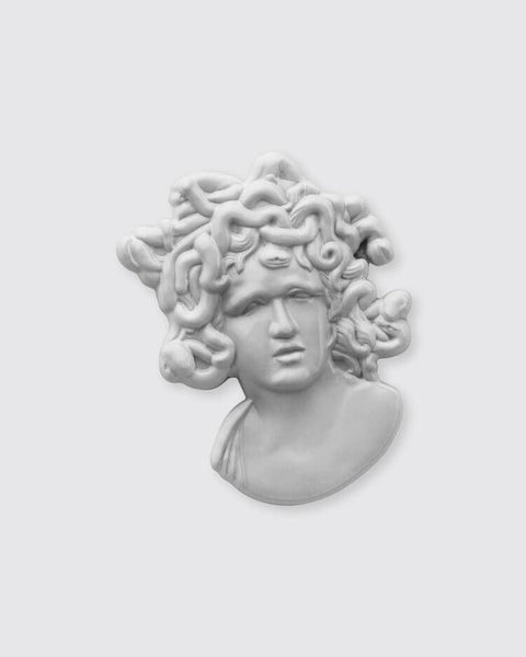 Statue of Medusa's head on a white background