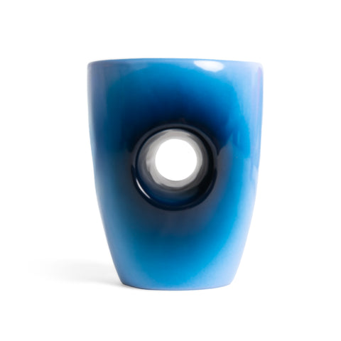 Blue ceramic vase with a central circular opening on a white background