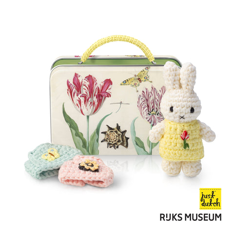 Crocheted bunny and flowers with a tin featuring floral design, Rijksmuseum and Just Dutch logo.