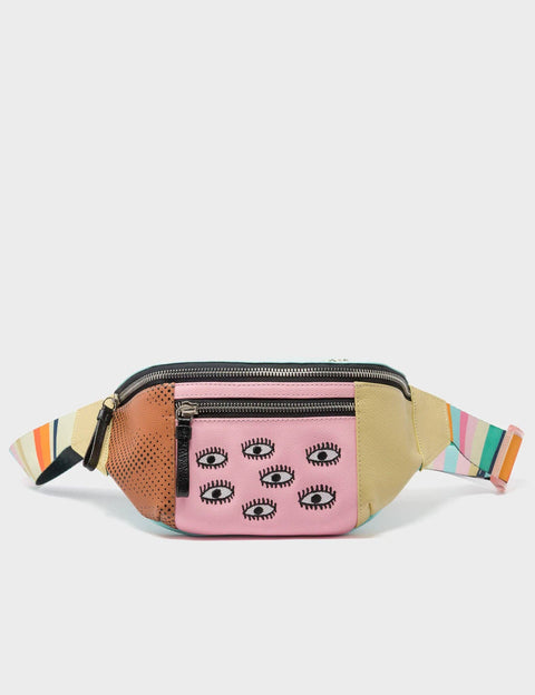 Multicolored fanny pack with eye pattern on a light gray background