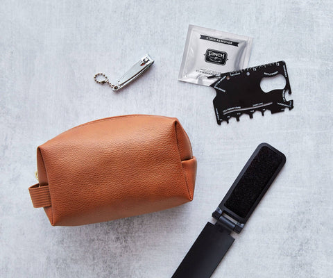 Emergency kit with various items on a gray background