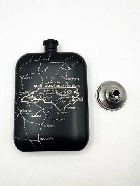 Black flask with a map of North Carolina on a white background