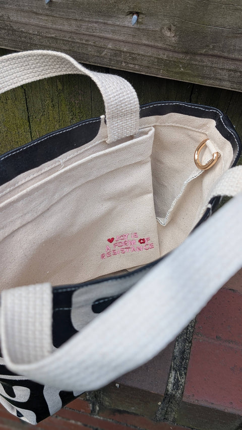 Close-up of a bag inside on a wooden surface