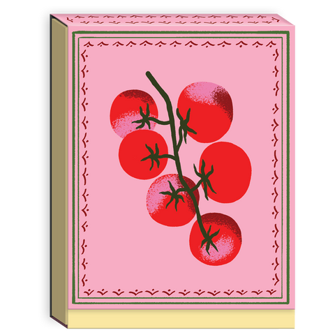 Notepad with red tomatoes on a pink background