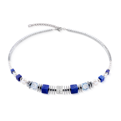 Necklace with blue and clear beads on a white background