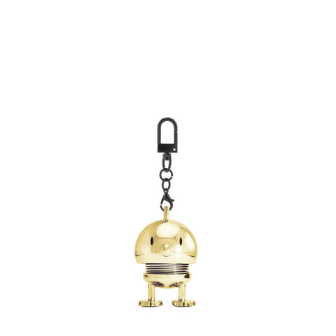 Gold robot keychain with a black strap on a white background