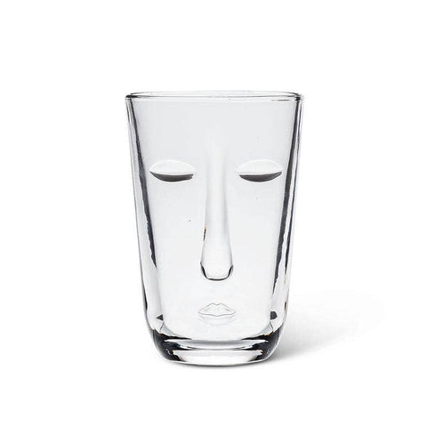Clear glass with a face design on a white background