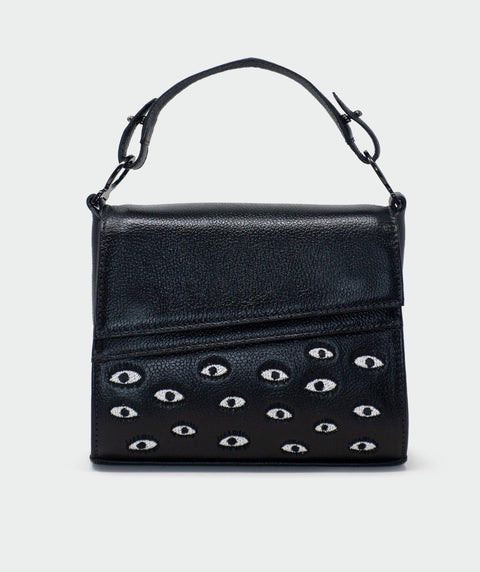 Black handbag with eye pattern on a white background