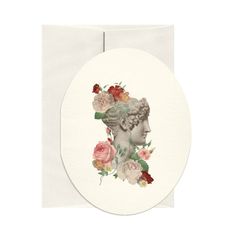 Greeting card with classical woman's head design featuring flowers on a white background