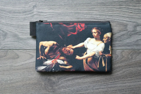 Pouch with classical painting design on a wooden surface