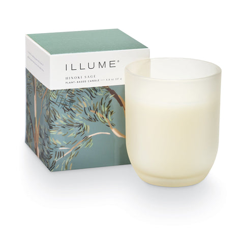 Illume candle with packaging on a white background