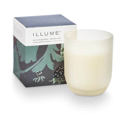 Illume candle with packaging on a white background