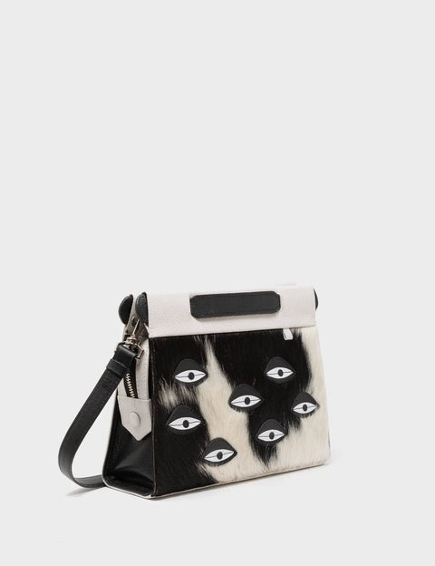 Handbag with black and white design on a light gray background