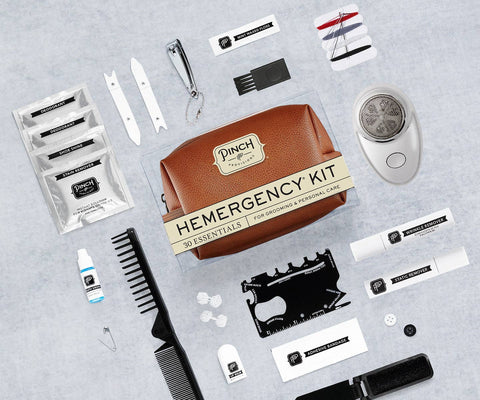 Emergency kit with various grooming items on a gray background