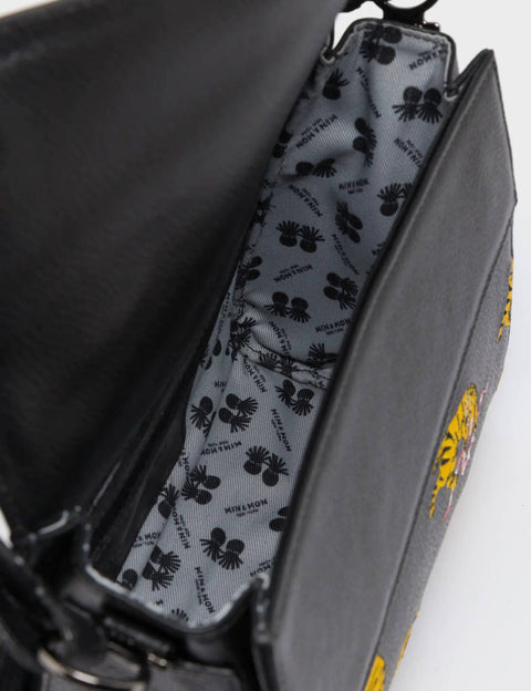 Black bag with a patterned interior lining.