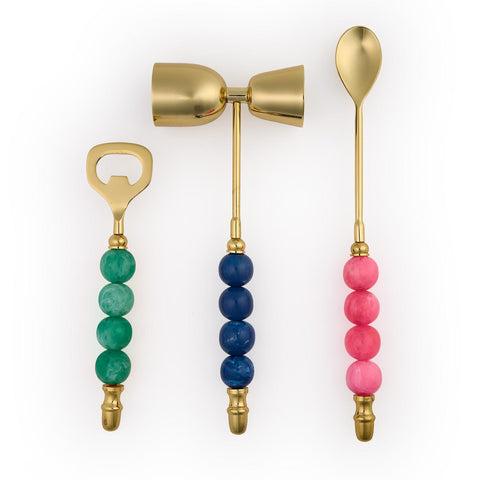 Set of three barware items with colorful bead handles on a white background