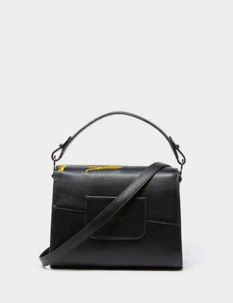 Black handbag with tiger designs on a white background
