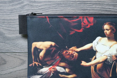Pouch with a design of a classical painting on a wooden surface.