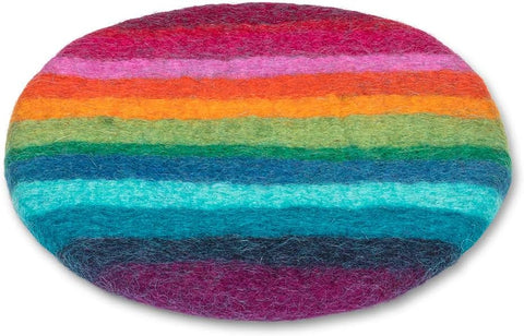 Round, multicolored felted trivet with rainbow stripes on a white background