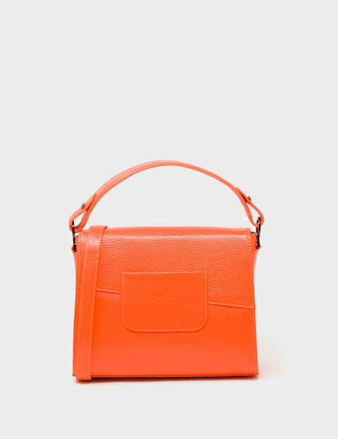 Orange handbag with a pocket on a light gray background