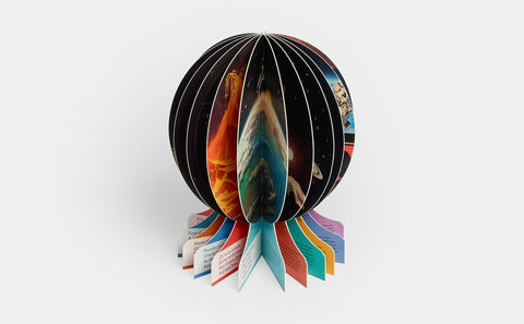 Spherical book with colorful pages on a white background