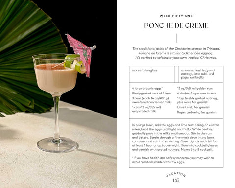 Cocktail glass with a cream drink and pink umbrella on a white surface, next to text about Ponche de Creme cocktail recipe.