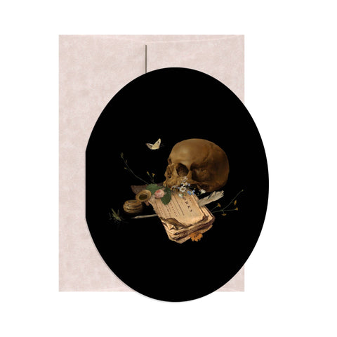 Greeting card with a skull, book, and butterfly on a black oval design.