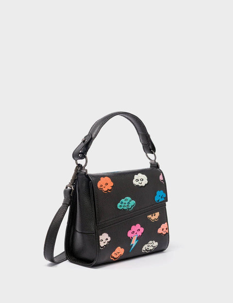 Black handbag with colorful designs on a light gray background
