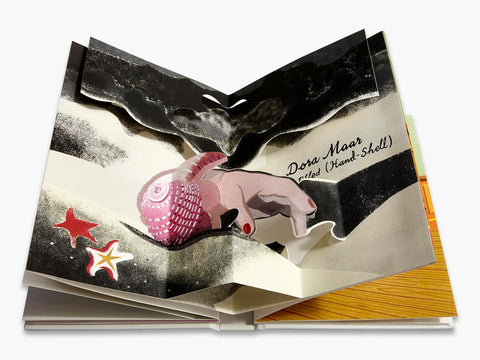 Open book with artistic illustrations of a pink creature and stars on a white background