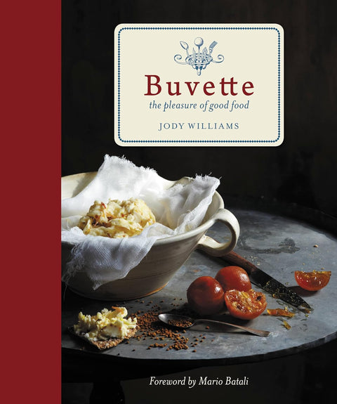 Book cover of 'Buvette' with a dish and tomatoes on a dark background