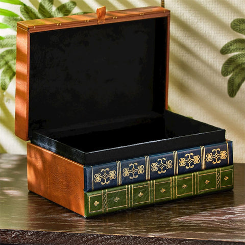 Decorative box with book design on a wooden surface