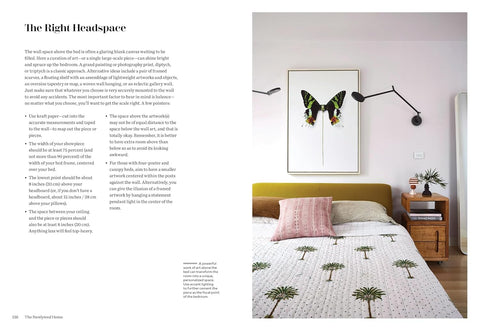 Bedroom interior with a bed, nightstands, and wall art.