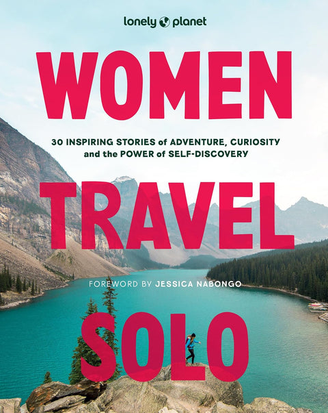 Book cover of 'Women Travel Solo' by Lonely Planet with a scenic mountain and lake background.