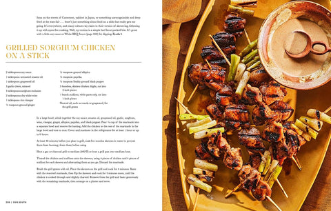 Grilled skewers of chicken and vegetables on a wooden plate with a side of dipping sauce and recipe on the left.