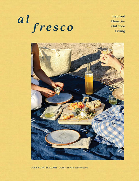 Book cover of 'al fresco' with people enjoying a meal outdoors on a yellow background