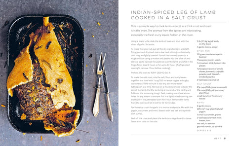Salt-crusted lamb leg on a tray with the recipe on a gray background