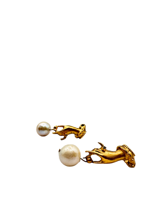 Hand Holding Baroque Pearl Earring