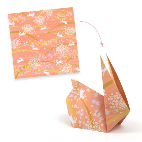 Origami crane with a floral pattern on a white background