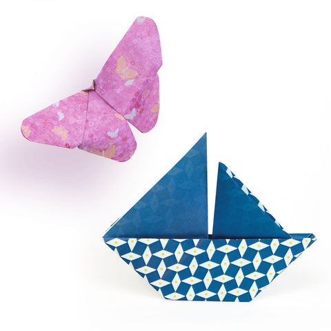 Origami boat and butterfly on a white background