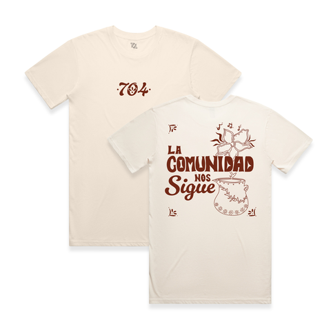 Beige t-shirt with red text and graphics on a white background